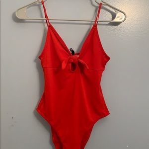 Red, stretchy, cute body suit